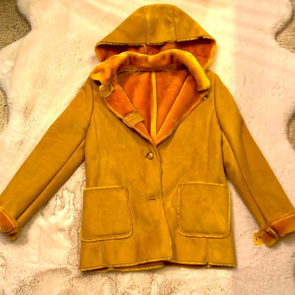 Designer unknown cozy jacket. The size seems to be small yellow gold in color
